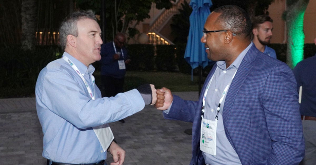 FSA-2022-Conference-Attendees-Fist-Bump-1200x628